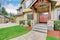 View of house entrance with stone column trim and double doors