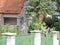 View of  house with fence and sunflowers, Tallinn