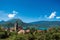 View of houses with belfry, in the village of Talloires, next to the Lake of Annecy.