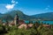 View of houses with belfry, in the village of Talloires, next to the Lake of Annecy.