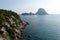 A view of a huge pyramidal rock called Es VedrÃ¡ near the island of Ibiza in The Mediterranean Sea
