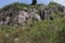 view from human eyes of group of mountain rocks stand high as the sky