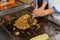 View of human, person hands holding tableware implement tools and prepairing, cooking fresh food