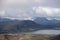 View on Hvanngil mountain hut and camp site with green hills, river stream and lake. Laugavegur hiking trail, Iceland