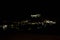 View at the illuminated city of Lindos and the acropolis by night