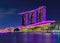 View of the illuminated famous luxury hotel, shopping center and casino Marina Bay Sands after sunset Singapore