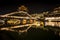 View of illuminated at night riverside houses in ancient town of Fenghuang, China