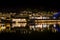 View of illuminated at night riverside houses in ancient town of Fenghuang, China