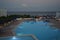 View of the illuminated pool and sea at Alpha Beach in the evening. Kolympia, Rhodes, Greece