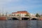 View on an imposing building with a bridge in foreground in amsterdam netherlands