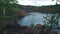 View on inactive abandoned granite quarry with beautiful blue water.