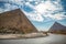 View of the incredibly majestic pyramid of the cheops on a sunny day in the desert with a road