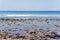 View on Indian ocean coast with pebble and sand beach on Bali, Indonesia