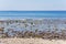 View on Indian ocean coast with pebble and sand beach on Bali, Indonesia