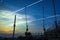 View of Industrial landscape with silhouettes of cranes on the sunset background From the windows of the electric train.Bangkok,