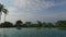 View from infinity edge pool to ocean and palms