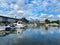 View on inland port with boats in summer with orange lifebelt, sealife building background