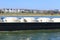 View on inland waterway tank vessel for gas transportation on river rhine, blurred citiyscape of oberkassel background focus on s
