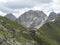 View on Innsbrucker Hutte mountain hut with moutain peak panorama at Stubai hiking trail, Stubai Hohenweg, Tirol Alps