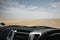 View from inside the cabin of a large 4x4 jeep driving across the desert in Namibia