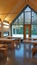 View from inside of the entrance to a Canadian cabanon. Wooden tables and metal elements.