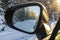 View inside mirror on beautiful winter landscape. Transportation concept.