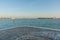View from Island of Lido to Venice under clear blue sky Italy