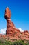 View on isolated balanced red sandstone rock on stone pillar against blue sky - Arches National Park, Utah