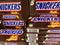 View on isolated Snickers chocolate bars in shelf of german supermarket