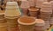 View on isolated stapled pile of brown terra cotta flower pots in german garden centre