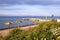 View of Issyk-Kul Lake, a beach with View of Issyk-Kul Lake with parasols and lawns with flowers