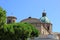 View of italian catholic roman cathedral in ravenna behind green