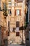 View of italian street with clothesline drying during sunset