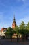 View of Itzehoe cityscape in summer with St. Laurentii church clock tower and blue sunset sky background