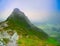 View on jagged mountain of Zillertal alps on a foggy summer day