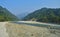 View of Jaldapara from Running Train near Doors on a summer day. Traveling to Dooars