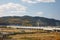 View on japanese countryside with highway bridge and forested hills on background