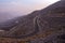 View from Jebael Jais mountain of Ras Al Khaimah emirate in the evening. United Arab Emirates, Light trails from the car