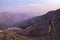 View from Jebael Jais mountain of Ras Al Khaimah emirate in the evening. United Arab Emirates, Light trails from the car