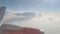 View of a jet air plane engine above clouds, travelling by air