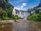 View of the Kalandula waterfalls on Lucala river, tropical forest and cloudy sky as background