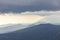 View of the Kamchatka mountains in overcast weather, Kamchatka Peninsula, Russia. Dramatic mount background