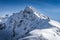 View from Kasprowy Wierch on adventurers climbing on Swinica mountain peak