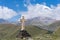 View of Kazbeg mountain and a cross, by the trinity church, Georgia