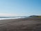 View from the Khalaktyrsky beach to the Pacific Ocean against the background of the blue sky. Kamchatka Peninsula, Russia