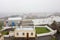 The view from Kinnaird Head Lighthouse, Fraserburgh, Scotland in heavy rain with a fog. Industrial dock in harbour