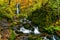 View of Komoi no Tagi waterfall in autumn season at Oirase Gorge