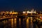 View of the Kremlin embankment and the Moscow River from the Patriarshy Bridge at night