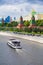 View of the Kremlin Embankment with a pleasure vessel sailing along the river editorial