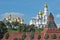 View of Kremlin wall with tower and Cathedrals photo made from opposite bank of the river Moscow